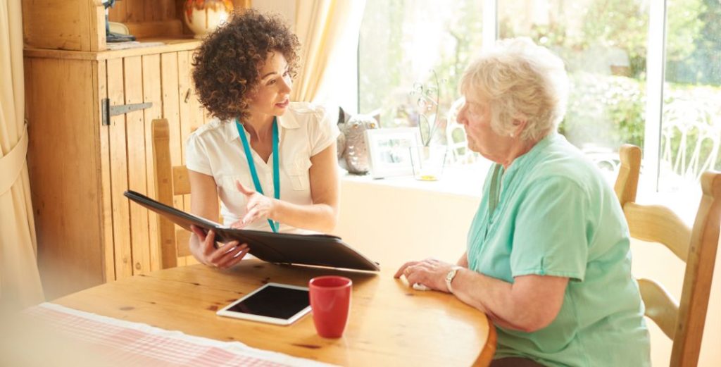 LTCI care manager meeting with elderly woman