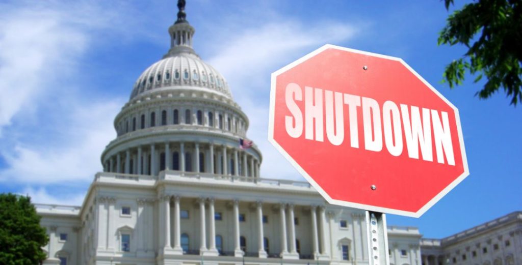 shutdown sign in front of U.S. Capitol building