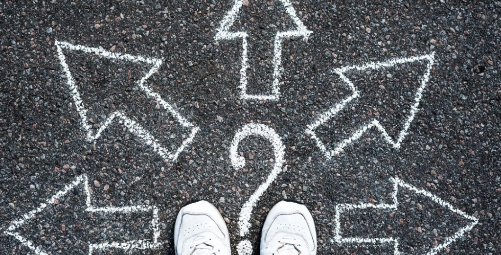 feet standing by chalk arrows